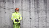 man leaning against a wall