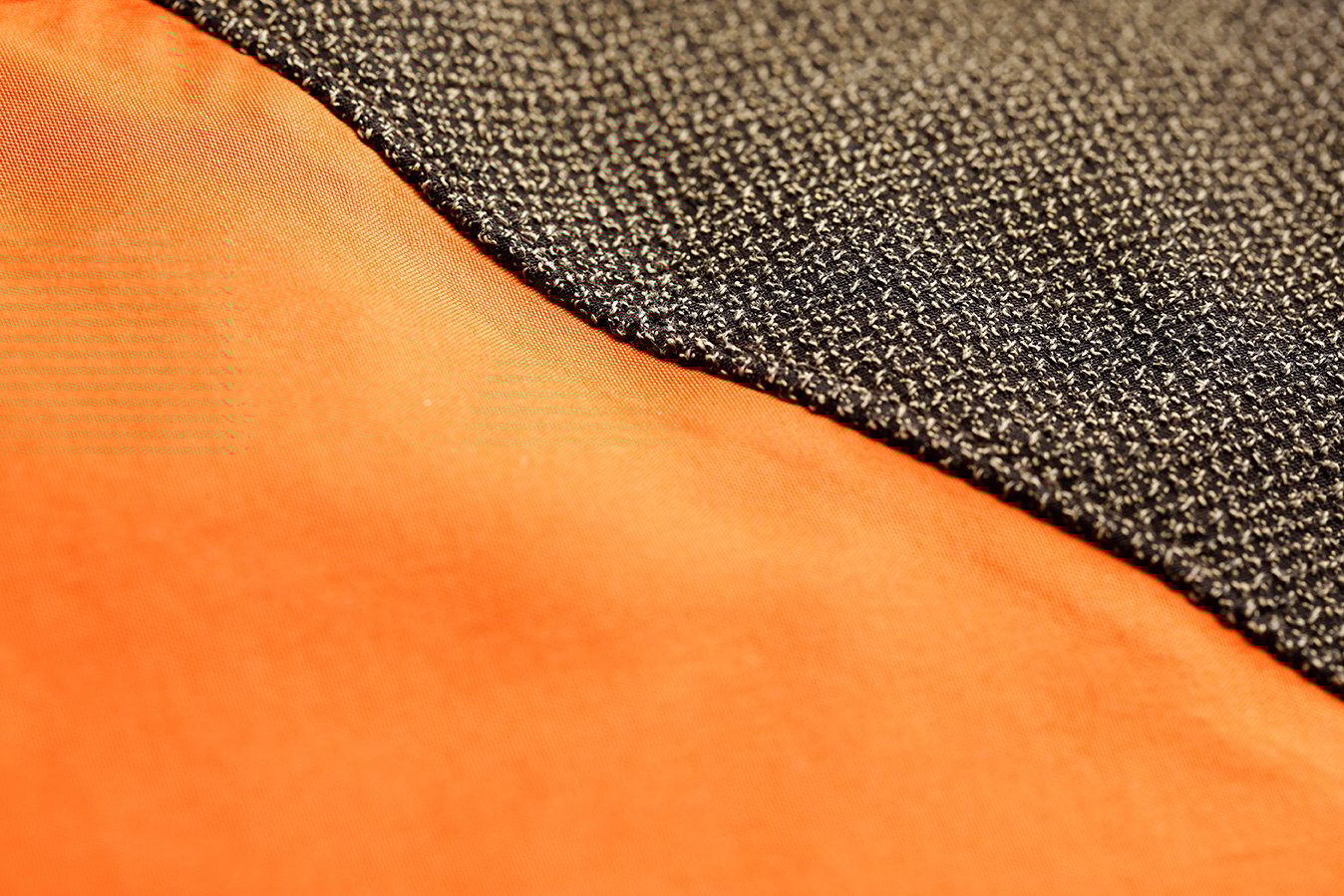 Detailed shot of vibrant orange and black fabric