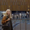 A female participant in the Circular Voice survey stands in a shopping centre.