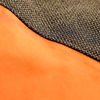 Detailed shot of vibrant orange and black fabric