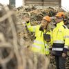 Two Stena Recycling employees conversing in a scrap yard.