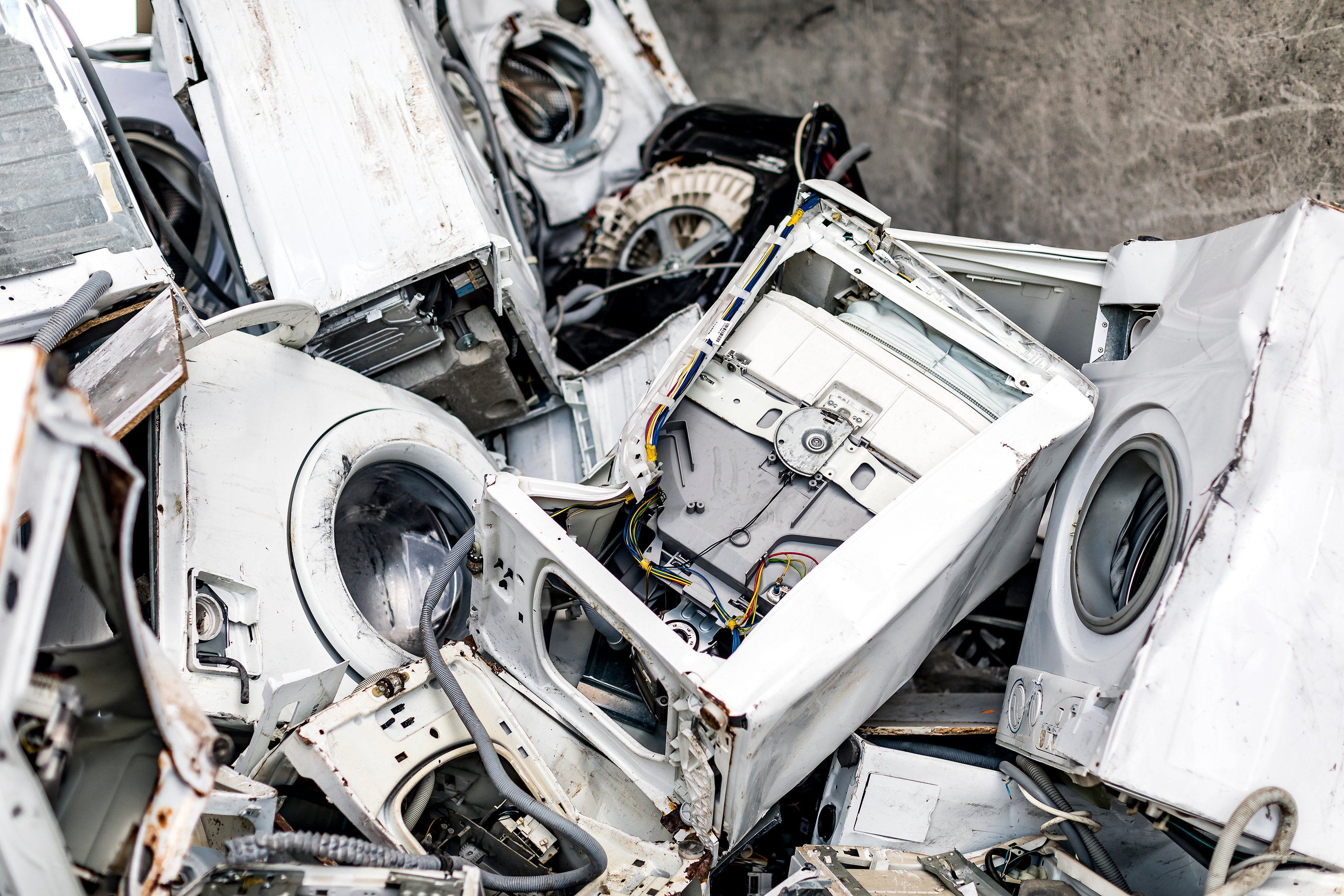 An array of discarded washing machines.